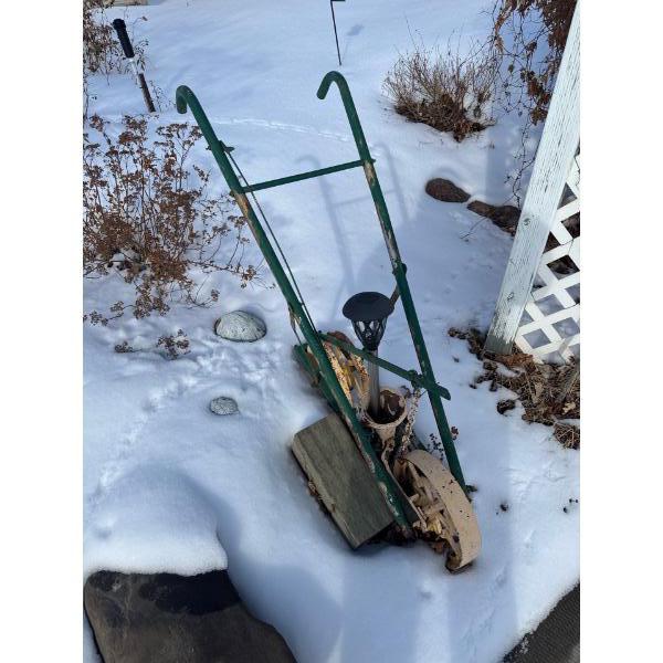  vintage or antique hand-push garden cultivator or tiller. 