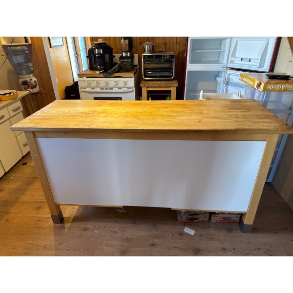  kitchen island featuring a butcher block countertop, drawers, and open shelving. 
