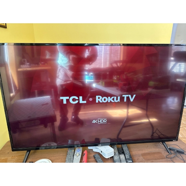 TCL Roku Smart TV featuring 4K HDR resolution. 
Built-in Roku OS provides access to thousands of str