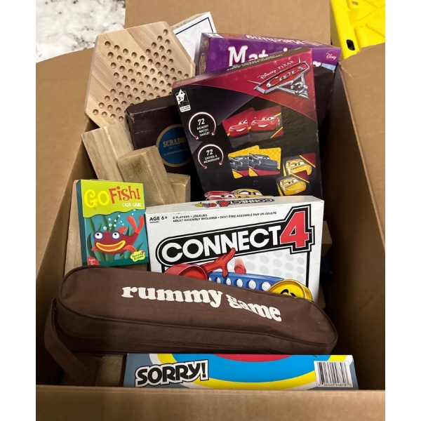 Box full of games. Scrabble, Connect Four, Rummy, Sori, Go Fish, Chinese checkers, and chess.