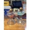 Image 1 : collection of vintage glass oil lamps, also known as kerosene or hurricane lamps. 
Function: These l