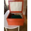 Image 2 : leather orange ottoman. Contents included. Unknown items.