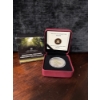 Image 1 : a 2014 25-cent coloured and glow-in-the-dark coin from the Royal Canadian Mint featuring the prehist