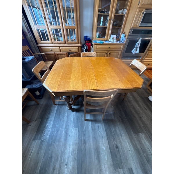  wooden dining set with a drop-leaf or extendable table and matching chairs. 