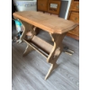 Image 2 : Wooden side table featuring a rectangular top with beveled edges and a decorative cutout base. The t