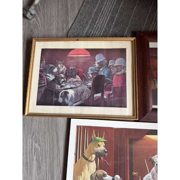 Three framed prints and paintings featuring dogs in humorous, anthropomorphic settings. One print po