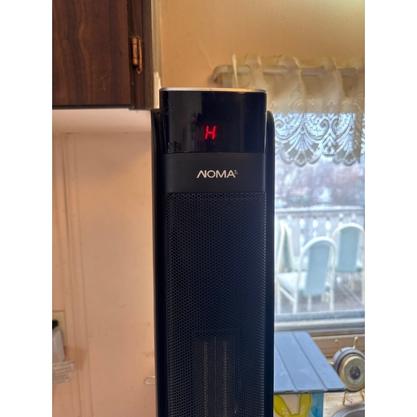 This is a NOMA Oscillating Tower Ceramic Heater. 
It uses ceramic, fan-forced heating to quickly hea