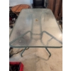 Image 5 : One rectangular glass-top patio table with a central umbrella hole and a metal frame, along with six