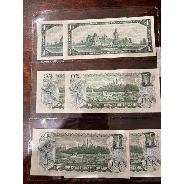 collectible Canadian one dollar banknotes, specifically the 1967 Centennial of Confederation issue. 