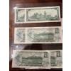 Image 1 : collectible Canadian one dollar banknotes, specifically the 1967 Centennial of Confederation issue. 