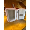 Image 1 : A portable 4-liter thermoelectric mini fridge and warmer, model AAD-4LA1. Operates in both cooling a