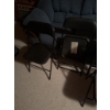 Image 2 : Four folding chairs including two with black metal frames and vinyl seats and two with black metal f
