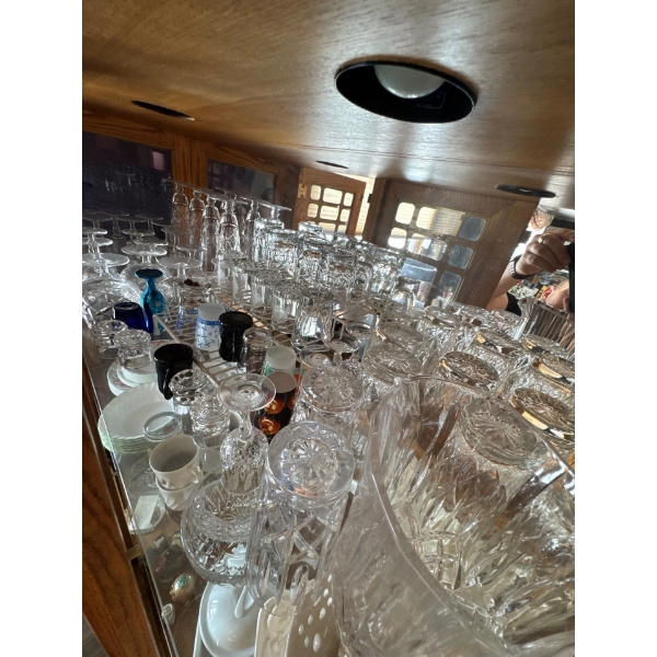 Cross and olive crystal set entire top shelf.