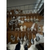 Image 3 : collection of souvenir or collectible spoons on a custom wooden display rack shaped like the contine