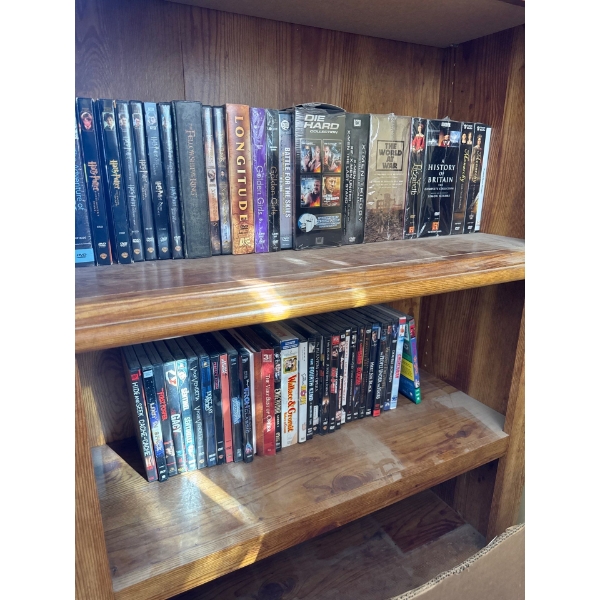 One shelf of DVD collections such as Harry Potter, Lord of the rings, golden girls, the adventure of
