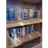 Image 1 : One shelf of DVD collections such as Harry Potter, Lord of the rings, golden girls, the adventure of