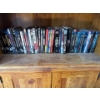 Image 2 : Indiana Jones, Star Trek, and other DVDs.