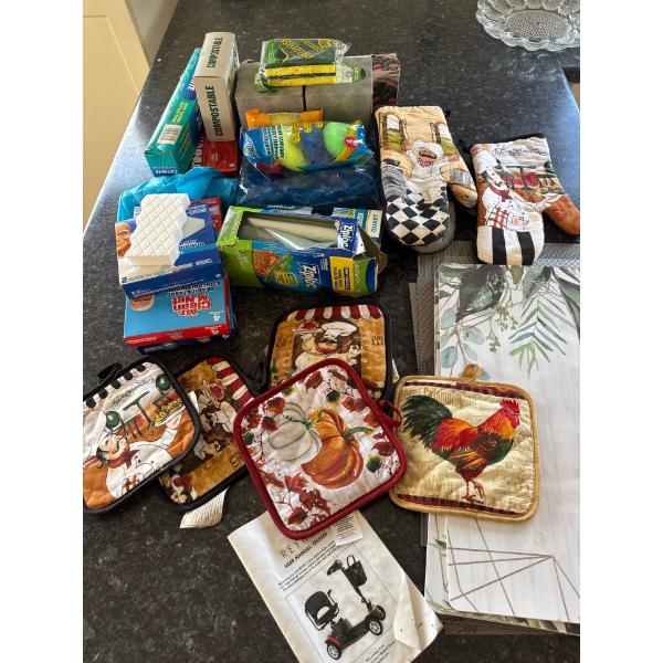 Kitchen supplies, hot pot mats, oven gloves, ziplock bags, Mr. Clean, tissues, scrubbing bubbles, 3 