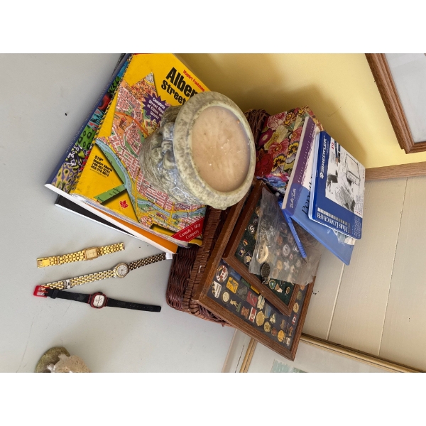 Three watches, picnic basket, pins, and other items.