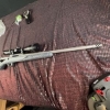 Image 2 : Ruger American bolt action rifle chambered in .243 Win, matte grey speckled synthetic stock, fluted 