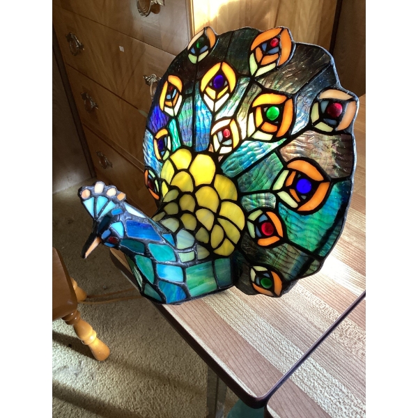  Tiffany-style stained glass peacock lamp. 
It is an accent lamp made of stained glass with a natura