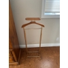 Image 1 :  a vintage wooden and brass valet stand for organizing men's clothing and accessories.