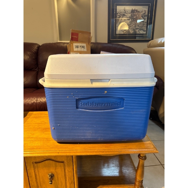 Rubbermaid cooler with cup holders on top.