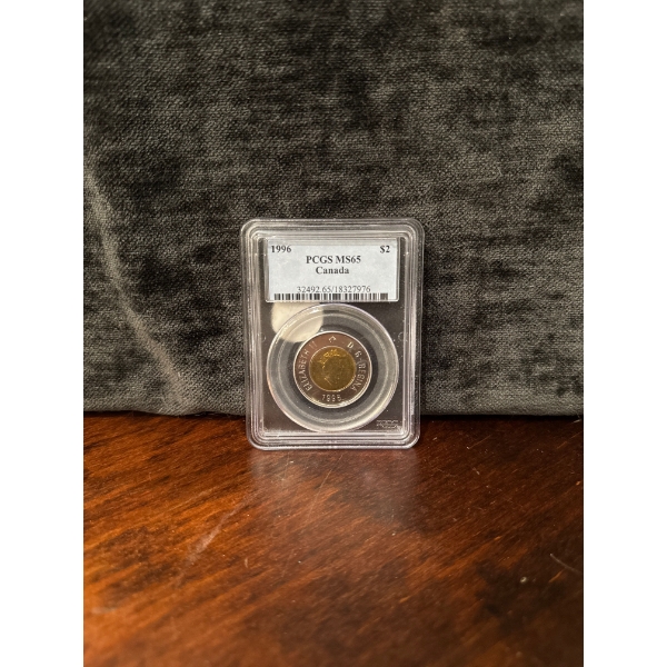  1996 Canadian two-dollar coin, known as a "toonie," encapsulated by the Professional Coin Grading S