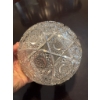 Image 2 : Cut crystal glass bowl featuring a geometric and scalloped edge design. The bowl displays intricate 
