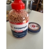 Image 1 : container of Crosman Copperhead .177 caliber BBs alongside a tin of pellets.
Product: Crosman Copper