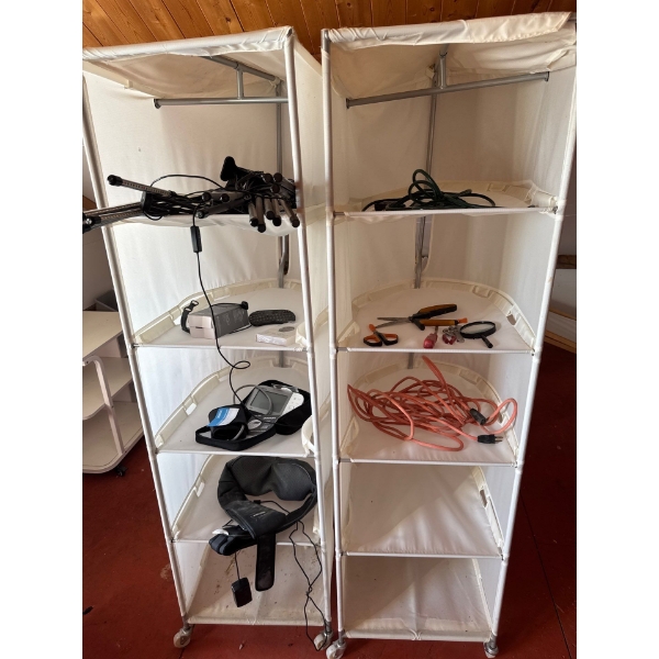 Two linen racks, fabric ones with aluminum frame. Contents not included. 67 tall by 19 wide by 24 de