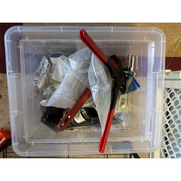 Box of plumbing supplies, pipe wrenches, copper piping, plumbing connections