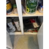 Image 6 : Miscellaneous items in the right cabinet of the laundry room, items include spray paint, pant, paint