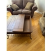 Image 6 :  Rustic wooden coffee table featuring a hinged top for storage and metal accents.   
