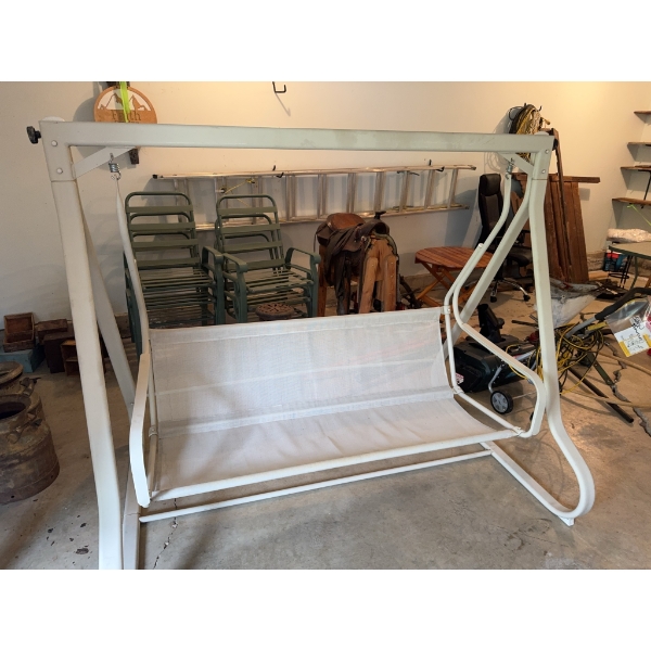 Outdoor swing featuring a cream-colored metal frame and mesh seat. Suitable for patio or garden use.