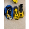 Image 2 : A set of yellow and black diving fins, a recreational water sport accessory for swimming