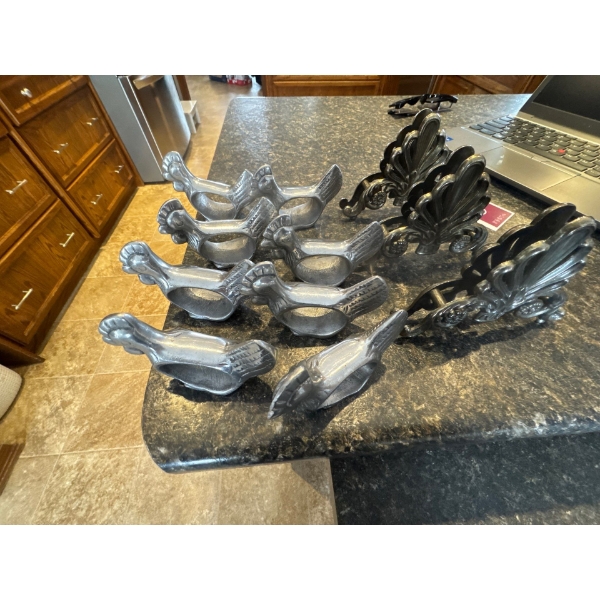 vintage CN RAIL figural rooster-shaped napkin rings, likely made of pewter or aluminum. 
