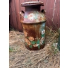 Image 4 : Two metal milk cans. One is decorated with hand-painted flower designs, and the other is solid green