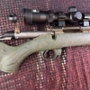 Image 3 : Ruger American bolt-action rifle chambered in 7mm-08 Rem. Features a green speckled synthetic stock,