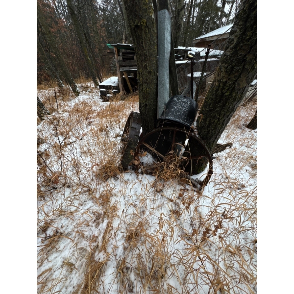 Antique farm equipment. Two wheels. Good lawn lawn ornaments.