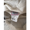 Image 1 : Woods Canada outdoor pullover jacket made from lightweight material in cream and black colors. Featu