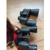 Image 2 : Bushnell binoculars, black finish, featuring textured grip and central focus adjustment. Includes a 