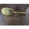 Image 7 : Gold-tone decorative hairbrush featuring ornate detailing on the back and handle and synthetic brist