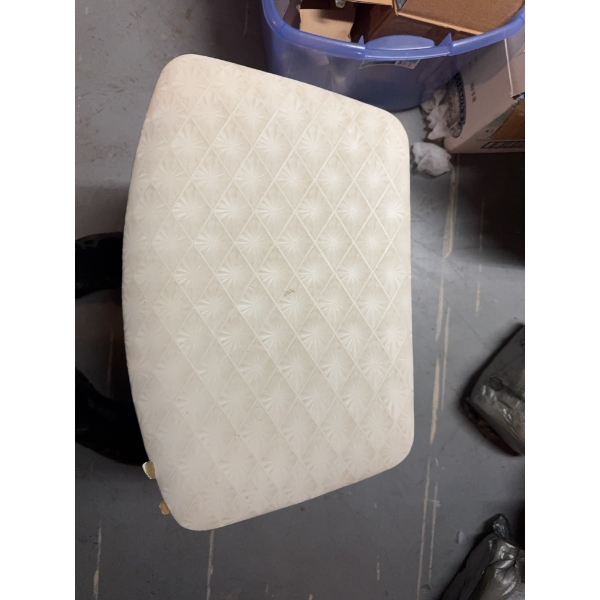 This is a vintage laundry hamper. The item has a hinged lid and an interior with ventilation holes. 