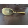 Image 1 : Gold-tone decorative hairbrush featuring ornate detailing on the back and handle and synthetic brist