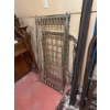 Image 2 : Vintage baby crib with a metal frame and spring mattress support. The crib is designed with a classi
