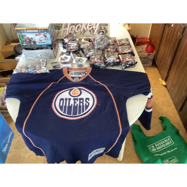 Oilers jersey with hockey board game, Oilers figurines, NHL figures, collectible items. Jersey is si