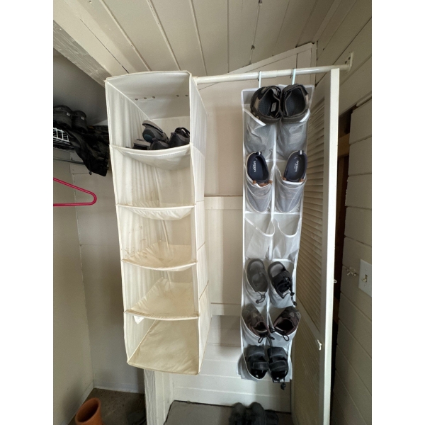 Two hanging organizers, a common home organization product designed to store footwear or other items