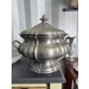 Image 1 :  antique pewter soup tureen with a lid, featuring a molded, multi-lobed design and two handles. 
Mat