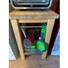 Image 1 : Movable wooden kitchen island or prep station with lower shelf. All kitchen supplies on the shelf in